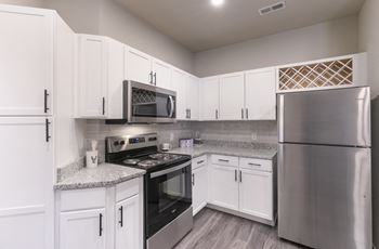 Shaker style cabinetry w/ built-in wine racks